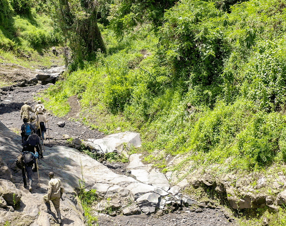 Safari walk along a dry riverbed in Murchison Falls National Park, Uganda - Nandi Adventures