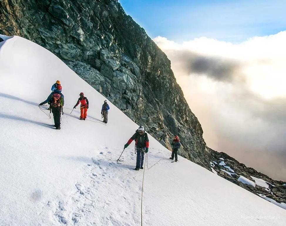 Climbers on the Rwenzori hike cross one of the tropical glaciers in the mountains.